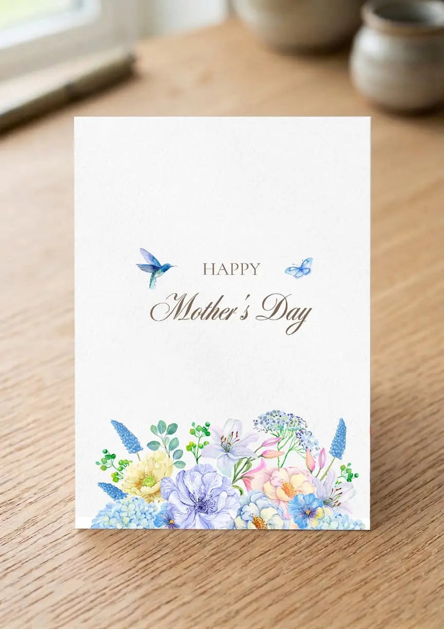 Mother's Day card with floral design and butterflies on a wooden surface