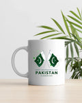 White mug with crossed Pakistan flags, fireworks accents, '14 August, 1947' — 14 August Pakistan Independence Day mug, Pak