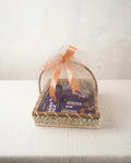 Woven 10x10 basket with Cadbury Dairy Milk Wafer Bars, Dairy Milk bars and Dairy Milk Bubbly wrapped in peach organza gift hamper by The Love Language Pakistan