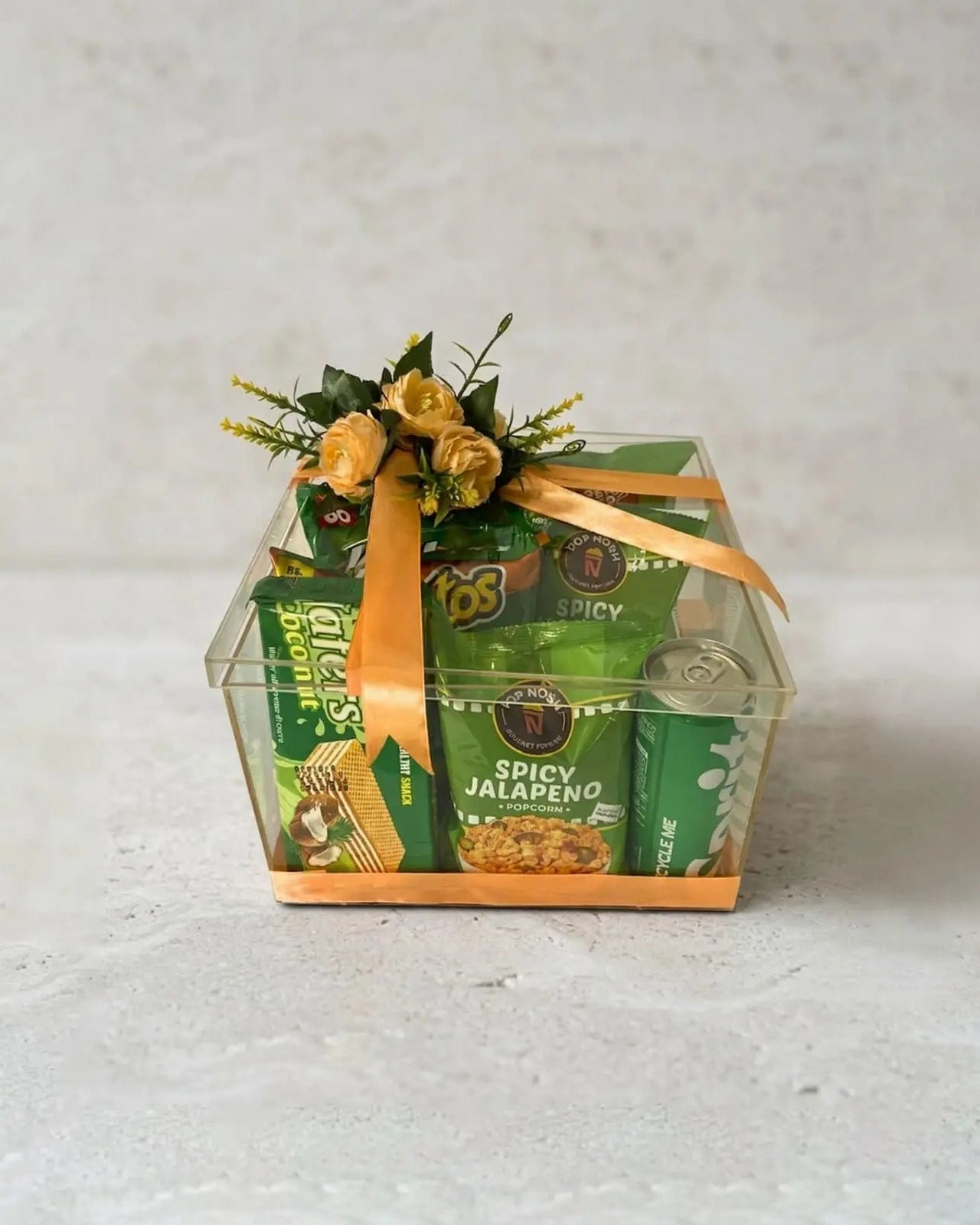 Green spicy snacks gift box with Fritos and Jalapeno Popcorn in clear acrylic box by The Love Language Pakistan