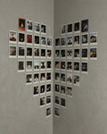 Heart shaped polaroid wall display with 62 polaroids arranged in corner wall Pakistan by The Love Language