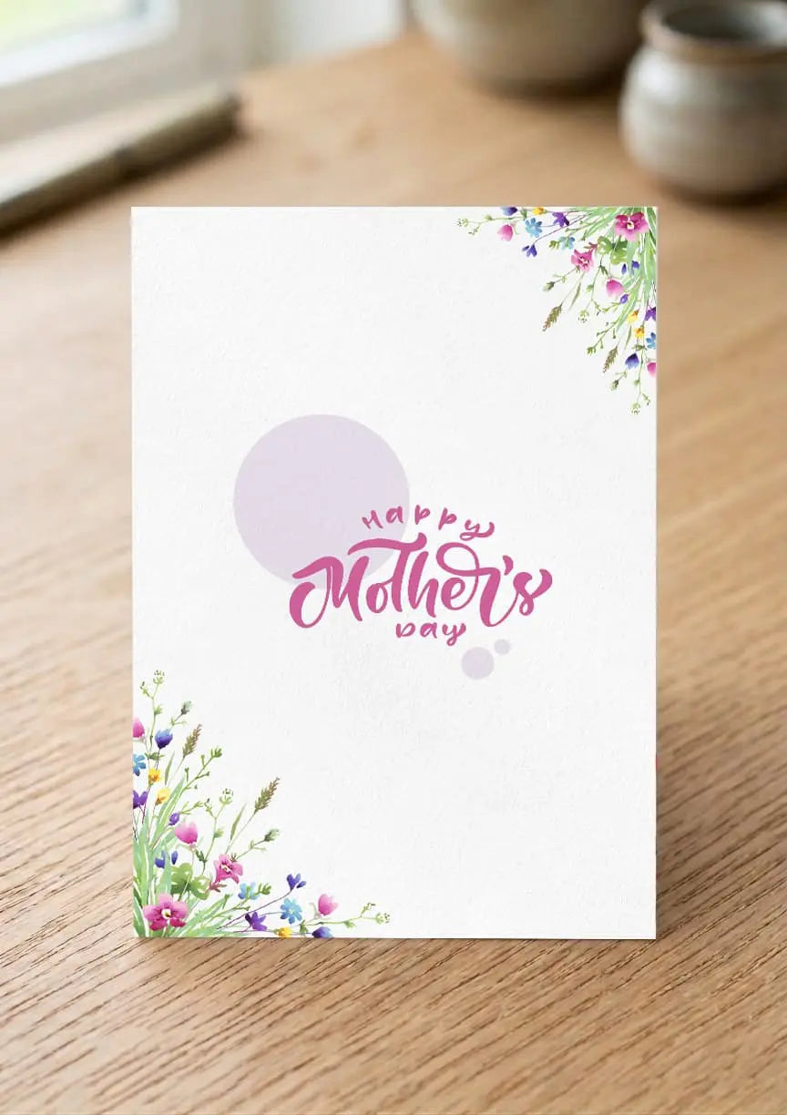 Mother's Day card with floral designs on a wooden surface