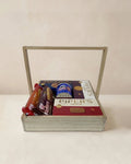 Wooden 12x12 Piper's Gold snack gift tray with Caramel Delight, Shortbread, Chocolate Chip cookies, Pringles and Jack n Joy wafers by The Love Language Pakistan