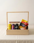Wooden 12x12 spicy hangout snack tray with Samyang Buldak noodles, Nescafe Mocha, Epic drink and Piper's Gold cookies gift hamper by The Love Language Pakistan
