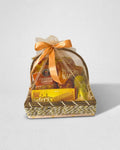 Yellow cheddar cheese popcorn and nachos snack gift basket with organza wrap by The Love Language Pakistan